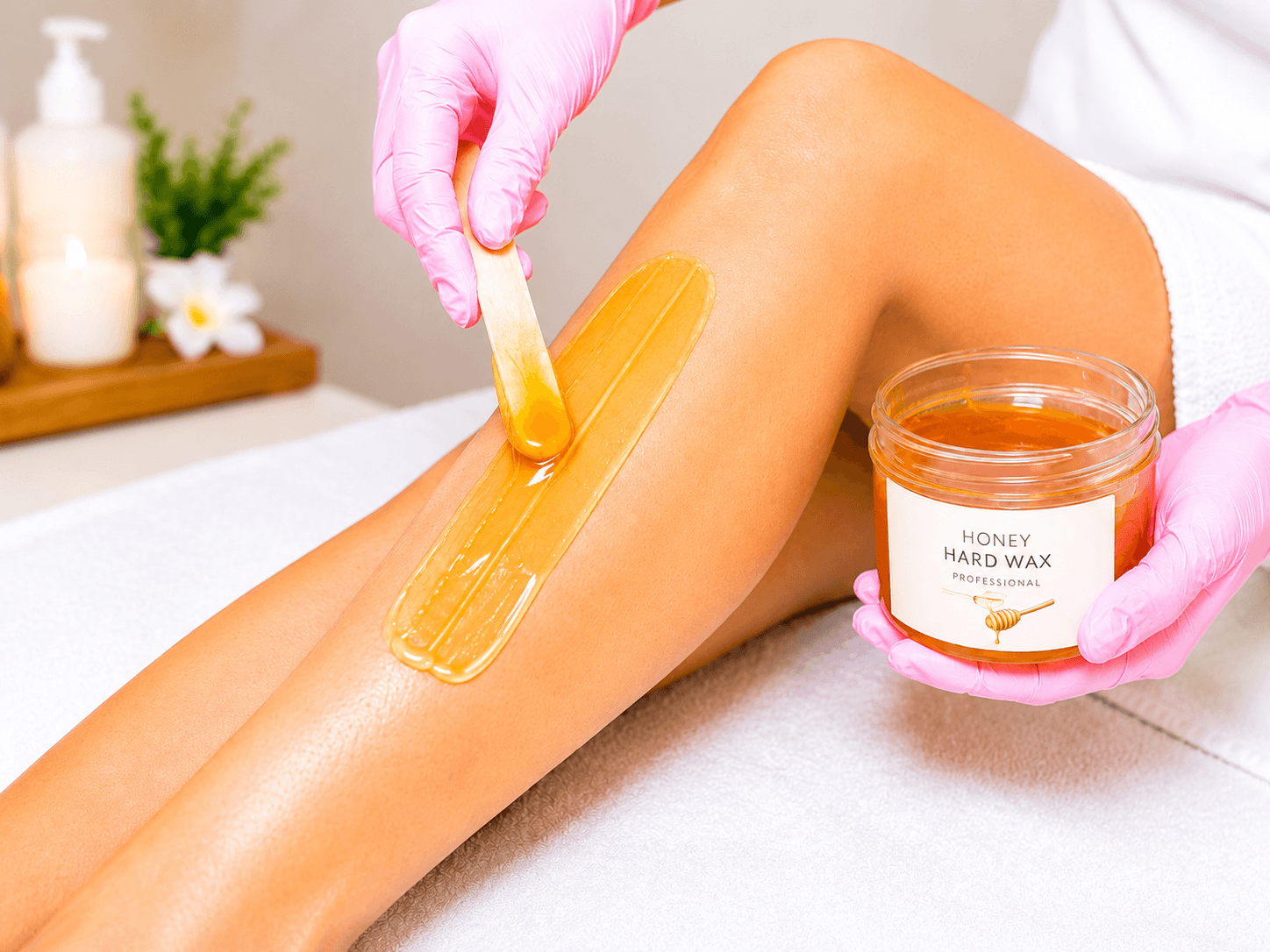 Professional leg waxing with premium pink wax at Alexandria Smooth Wax & Beauty